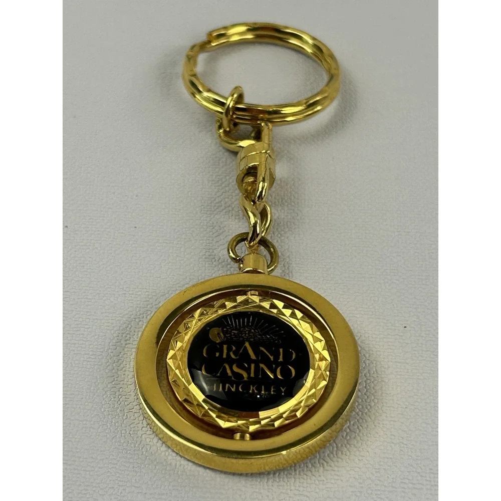 Vintage Grand Casino Mille Lacs Gold Tone Spinner Keychain Fob Souvenir